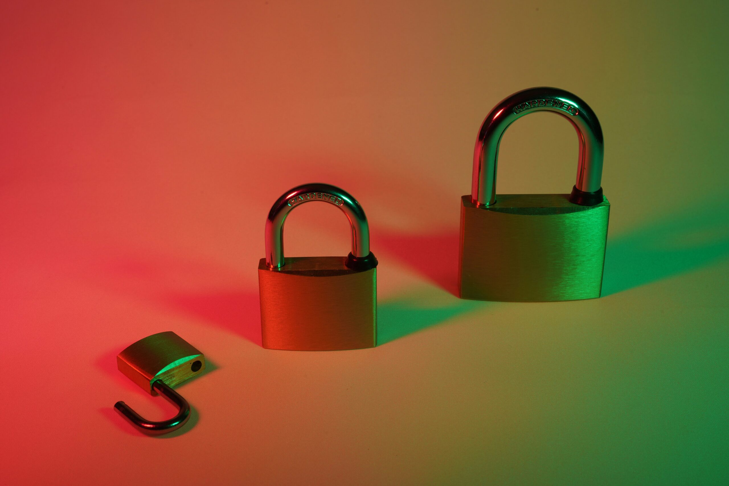 green padlock on pink surface